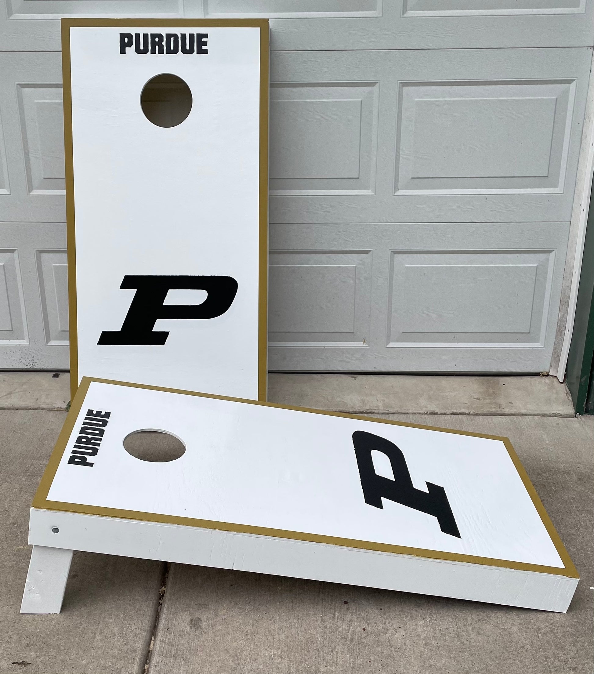 -You get 2 boards (2ft X 4ft) with folding legs. Boards are made from 1/2" Plywood & legs are made from premium 2x4.  -Hole is cut out & sanded for a smooth opening.  -Set is coated with an exterior grade Polyurethane for lasting protection.  -This set is official size set.  -Quality set to last you years of FUN!